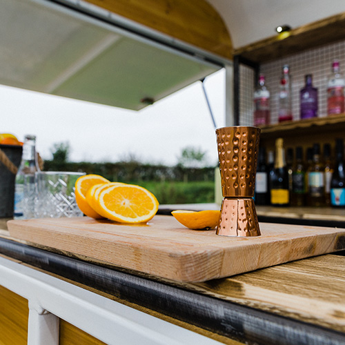 Cocktails being prepared at our fully stocked bar.